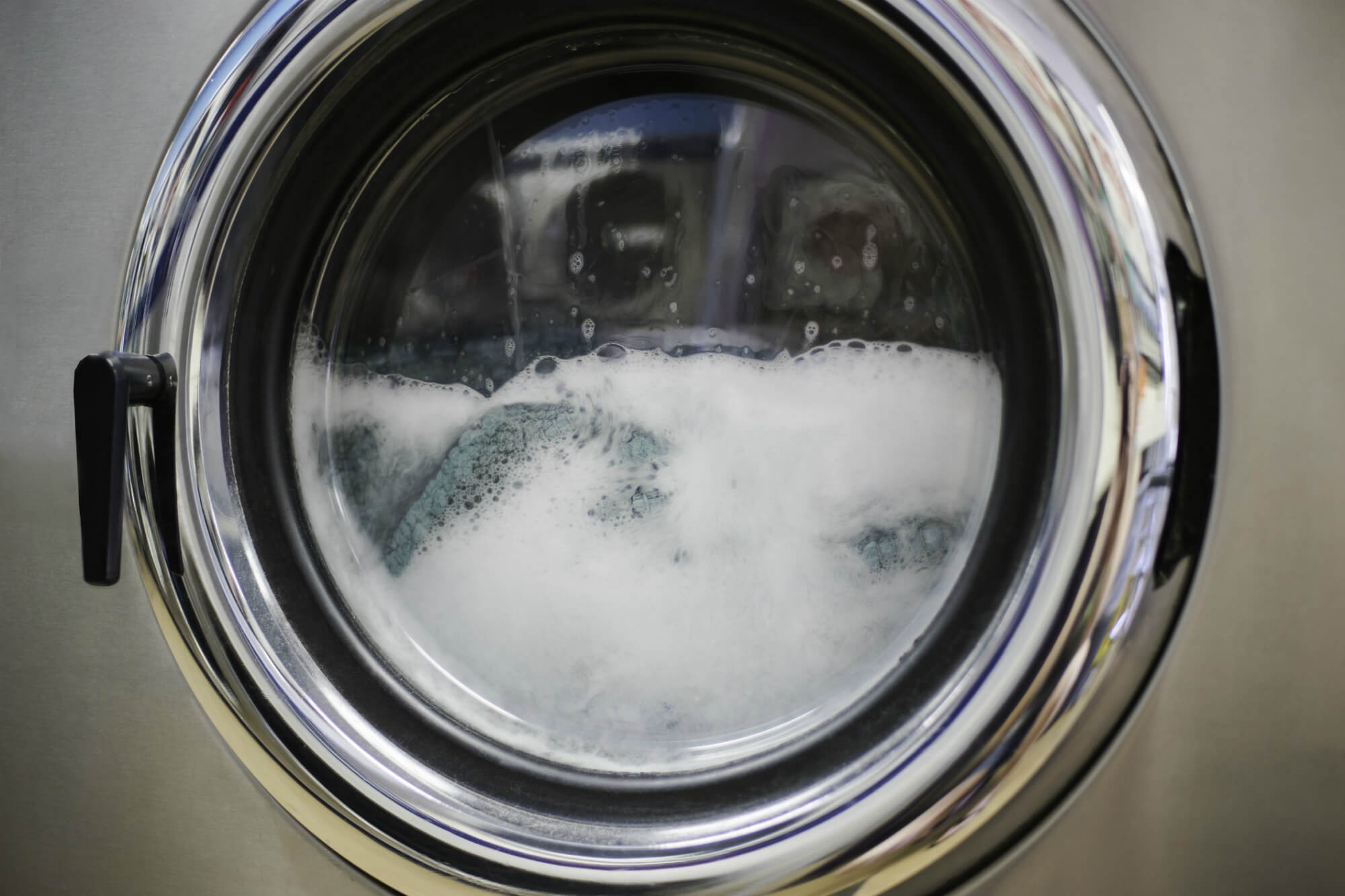 Can I use regular detergent to clean FR clothing?