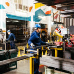 Employees at work in a manufacturing facility.