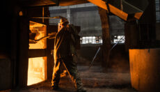 Steel worker near furnace