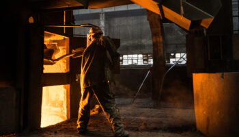 Steel worker near furnace