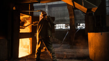Steel worker near furnace